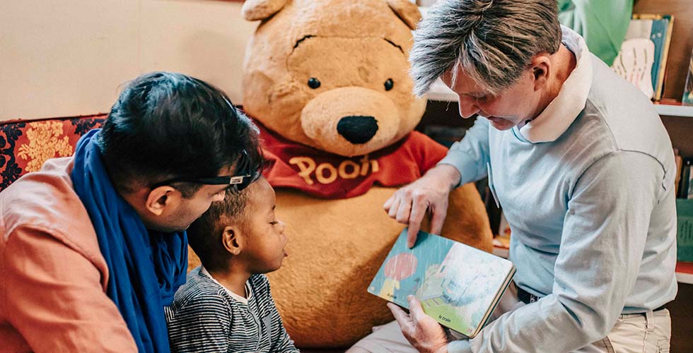 incentive travel trip attendee reading to local child in morocco